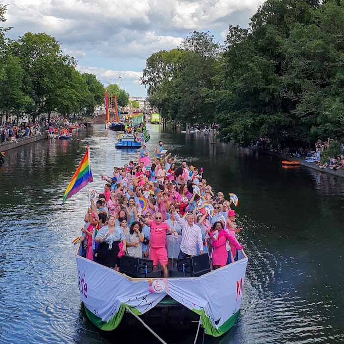 Amsterdam Canal Festival Pride - Boat with dressed people 4- Discover True Netherlands