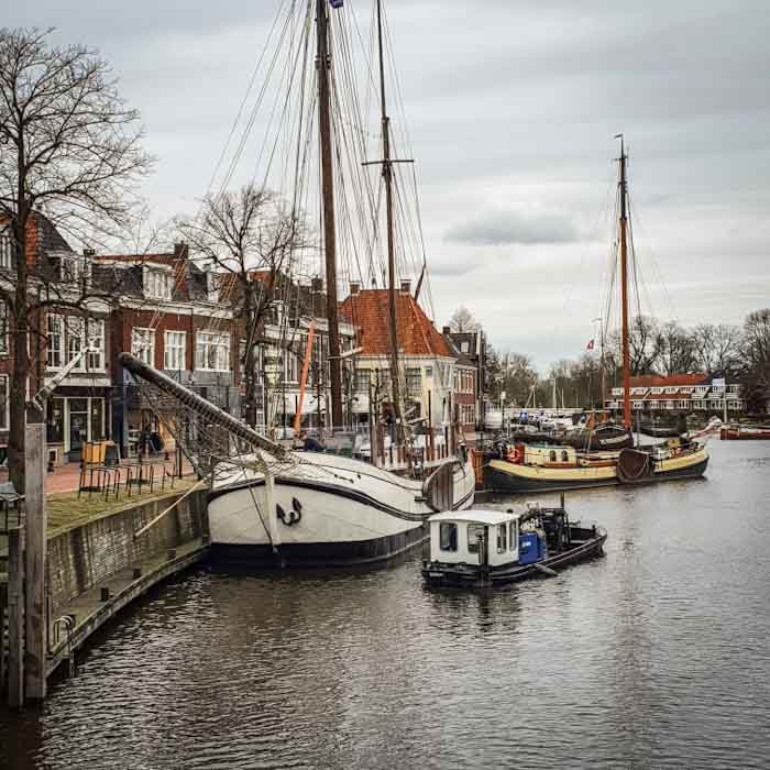 Dokkum habour with a giant ship - Discover True Netherlands