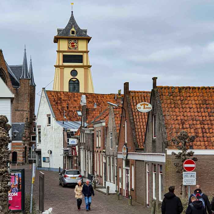 Enkhuizen yellow tower in the center - Discover True Netherlands