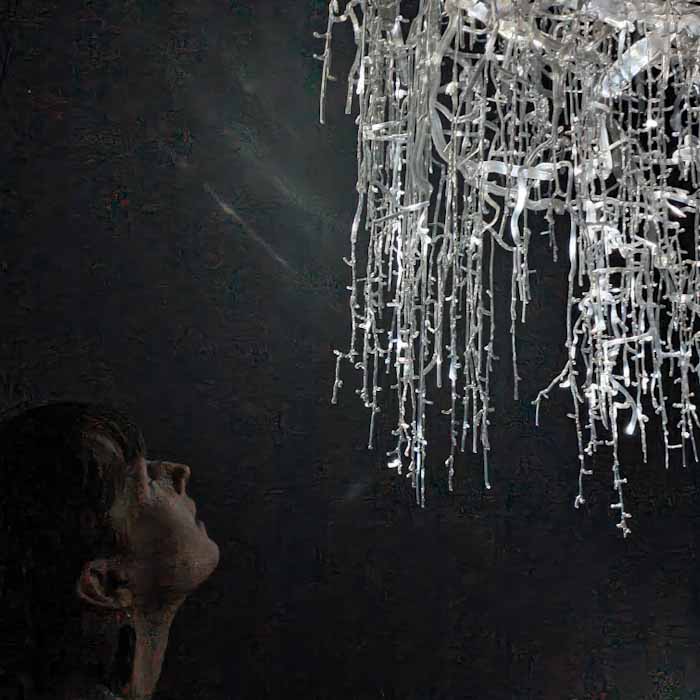 Nxt Museum in Amsterdam - woman looks to an artificial tree - Discover True Netherlands