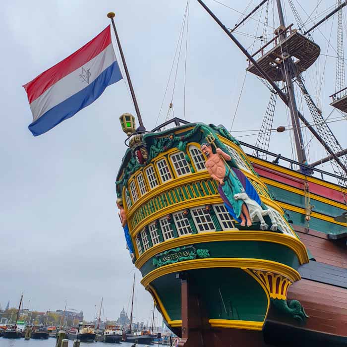 The National Maritime Museum - Het ScheepvaartMuseum - giant ship with a Dutch flag - Discover True Netherlands